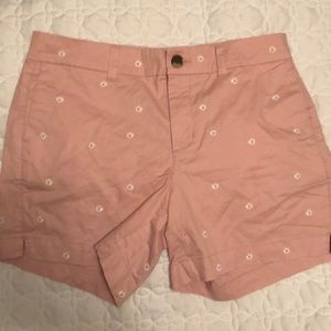 Pink shorts with white daisies